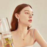 Boucles d'oreilles Perle Ă pompon đ«§