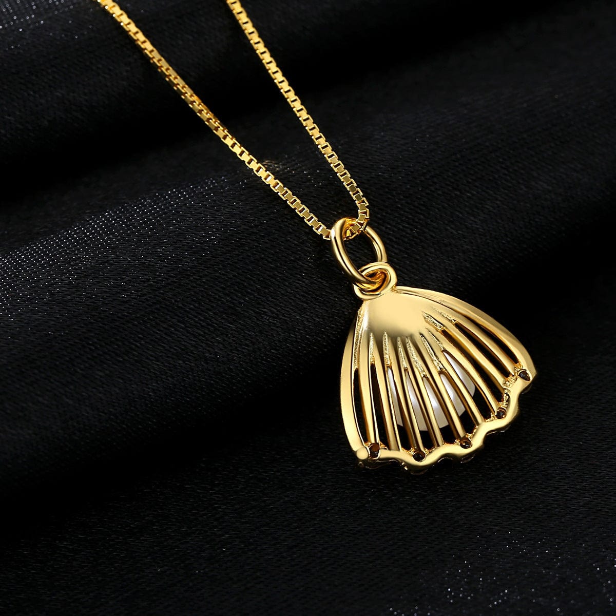 Pendentif perle pétoncle Or 18 carats